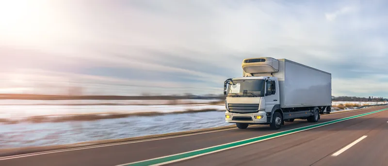 Refrigeration truck body vehicle driving on highway with insulated cargo box for cold chain transport